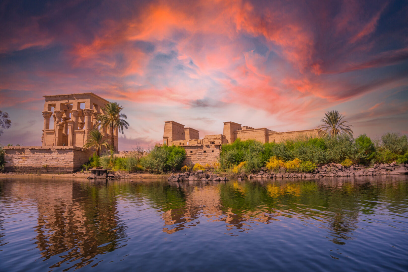 Incredible orange sunrise at the temple of Philae, a Greco-Roman