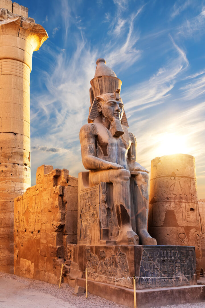 Seated statue of Ramesses II by the Luxor Temple entrance, Egypt.