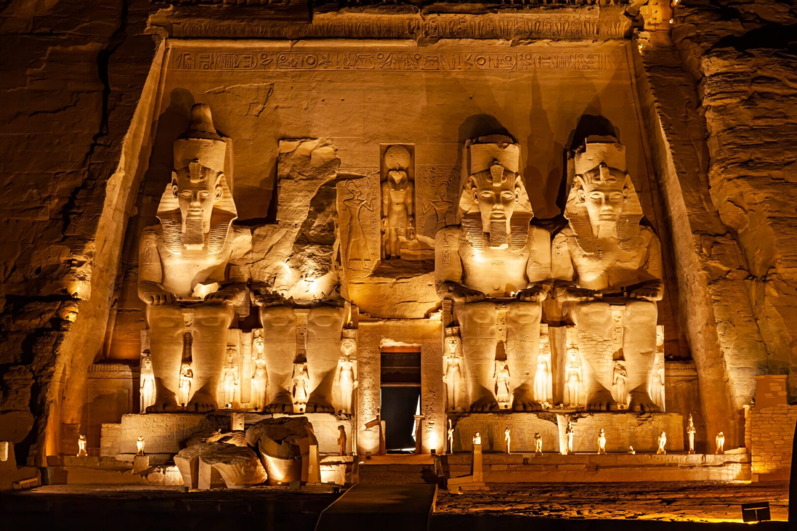 Statue of Pharaoh Ramses II in front of The Great Temple of Ramses II in Abu Simbel in the night, Aswan, Upper Egypt.