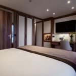 Cozy hotel room with warm lighting and modern decor.