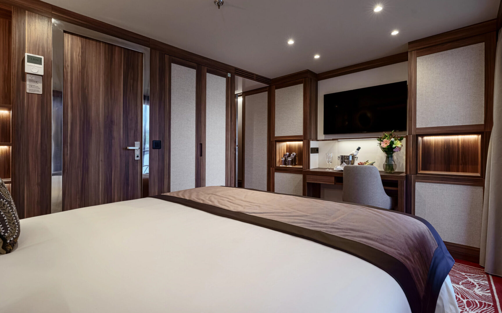 Cozy hotel room with warm lighting and modern decor.