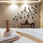 Elegant spa room with soothing decor and wall art.